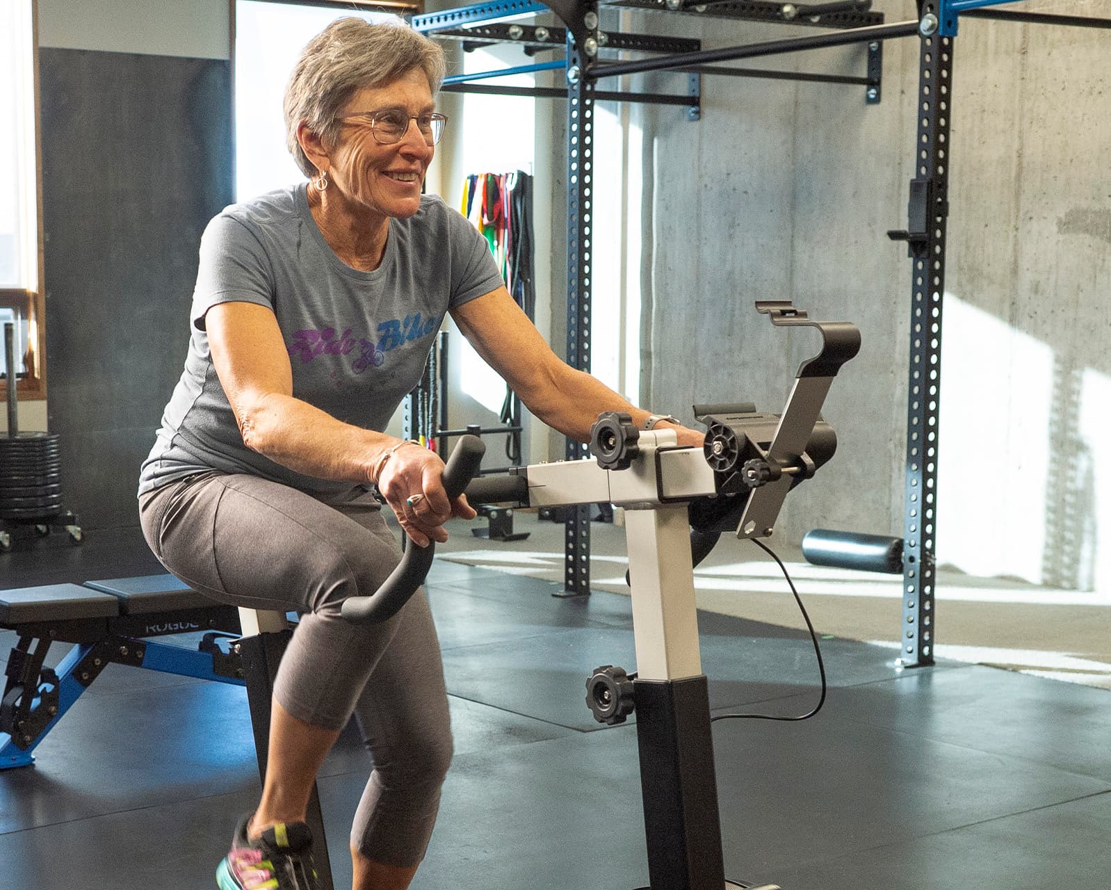 Gym Member working on the stationary bike during open gym